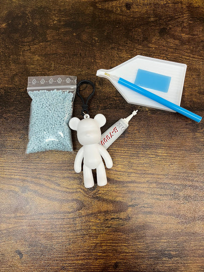 Porte-clés ours blanc avec poche de perles diamant bleues et stylet de pose