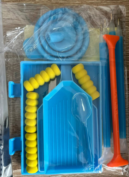 Valise de rangement avec plateau bleu, rouleaux jaunes et outil orange, en sachet