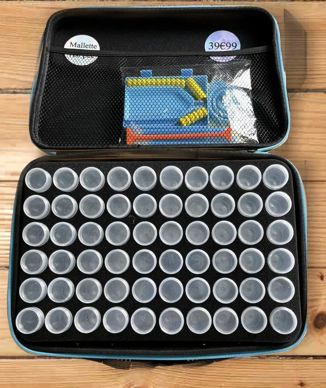 Valise de rangement ouverte avec compartiments circulaires pour perles, noir et bleu